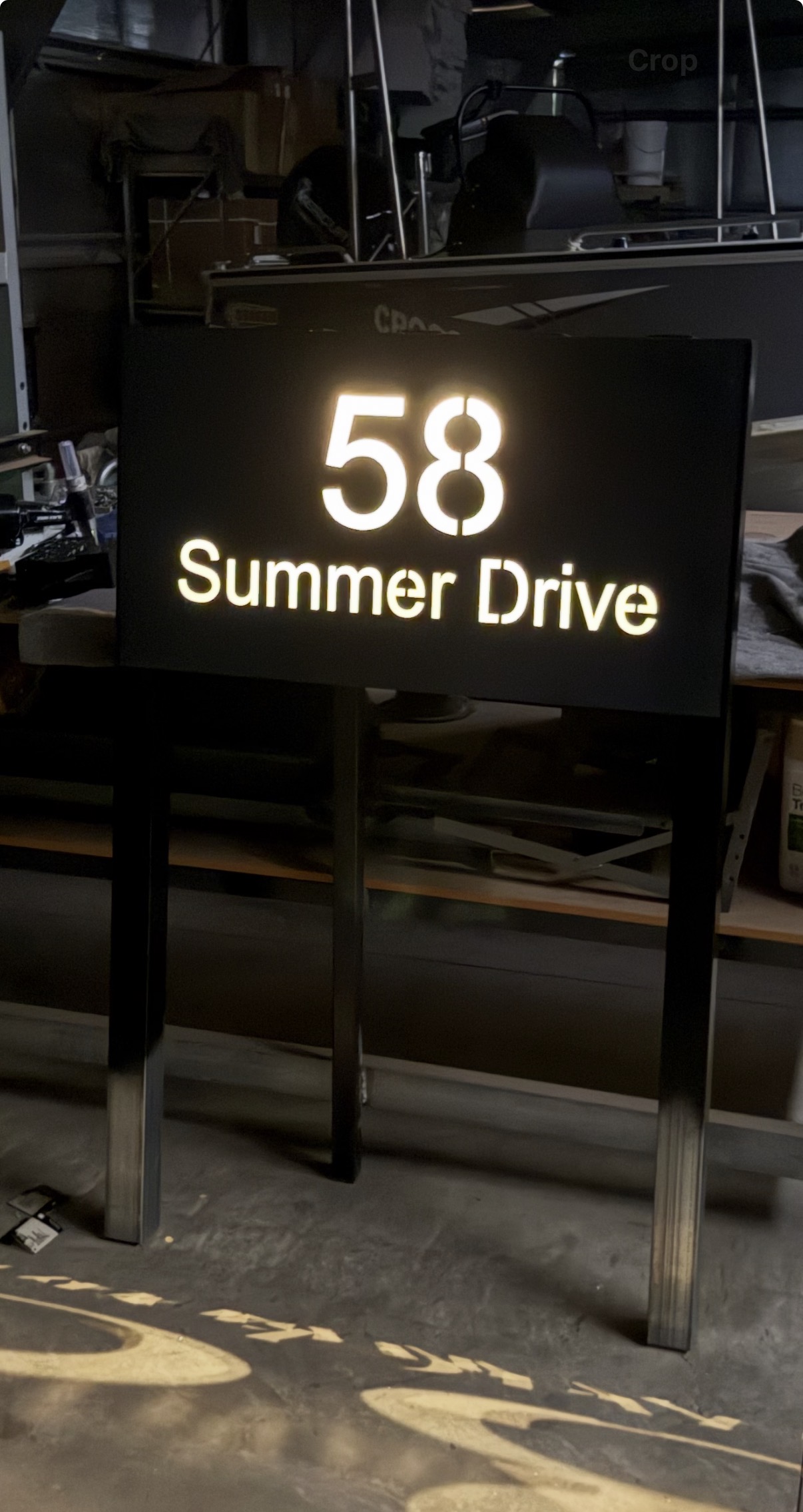 Black illuminated address pillar showing 58 Summer Drive