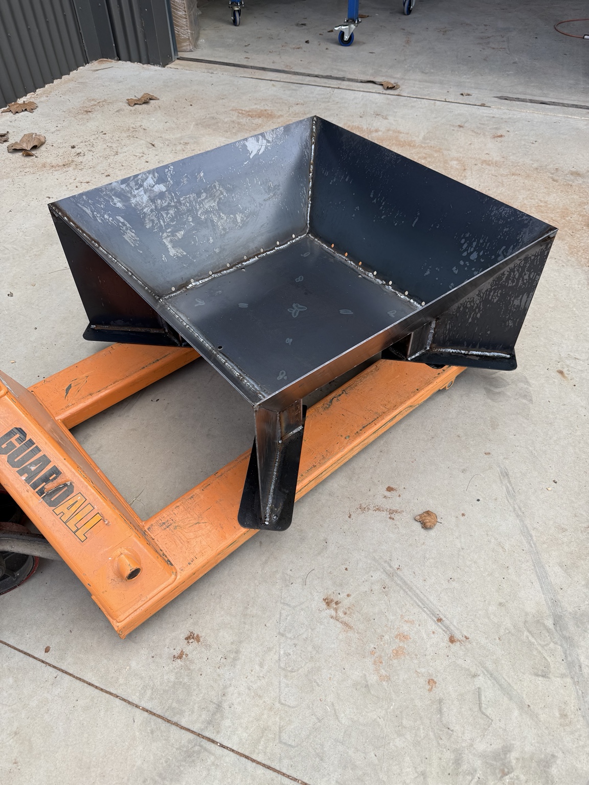 Folded steel firepit during fabrication in the workshop