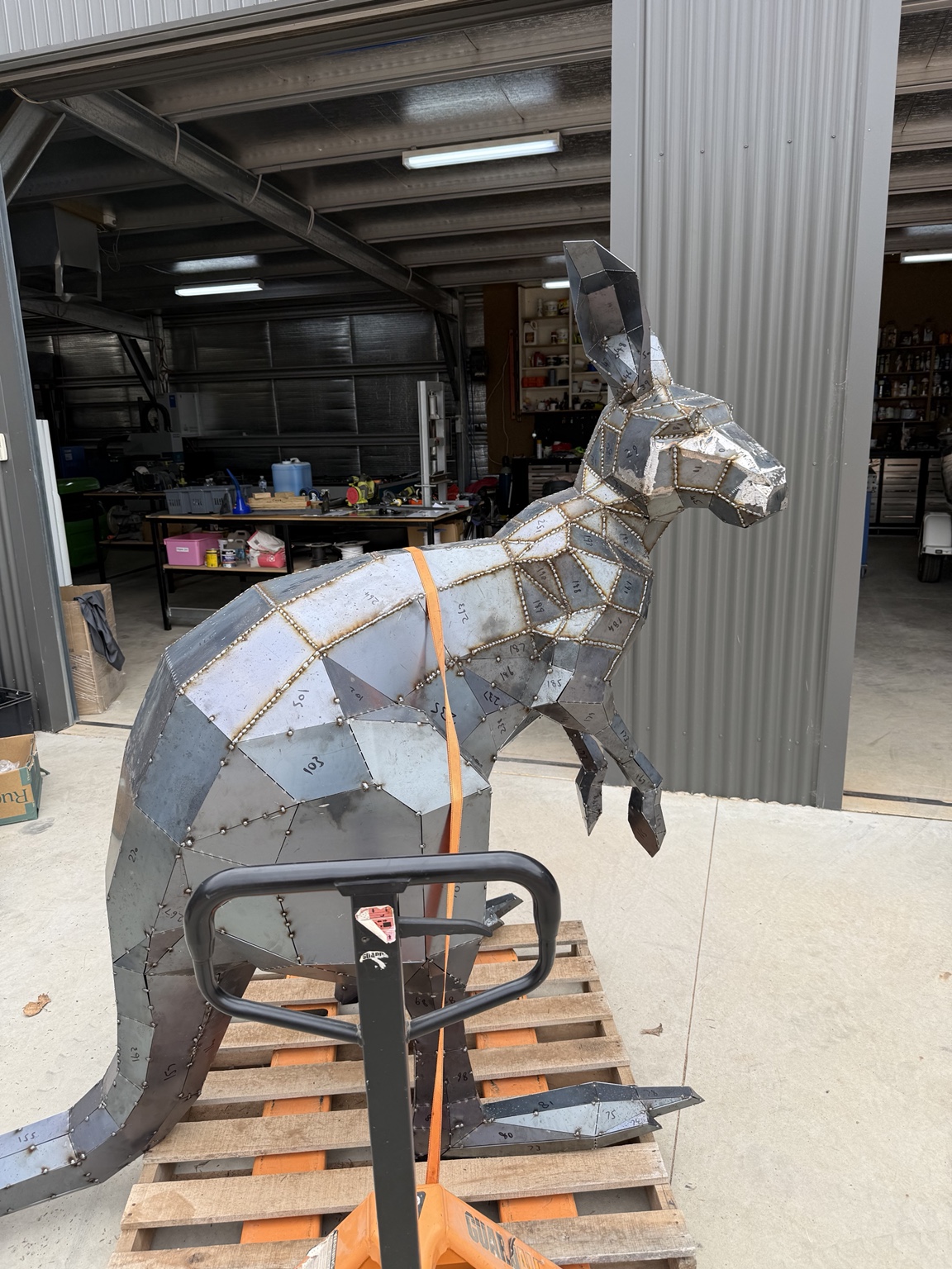 Three-dimensional kangaroo metal sculpture in the workshop