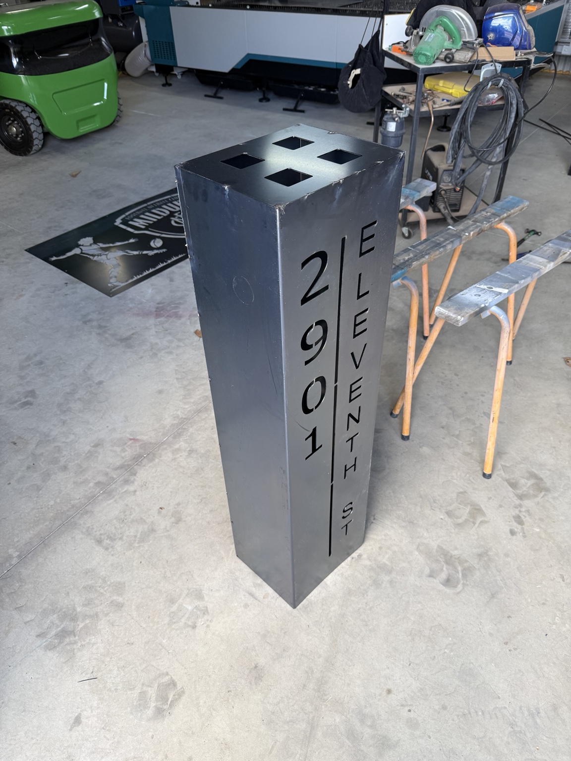 Unfinished metal address pillars in the workshop