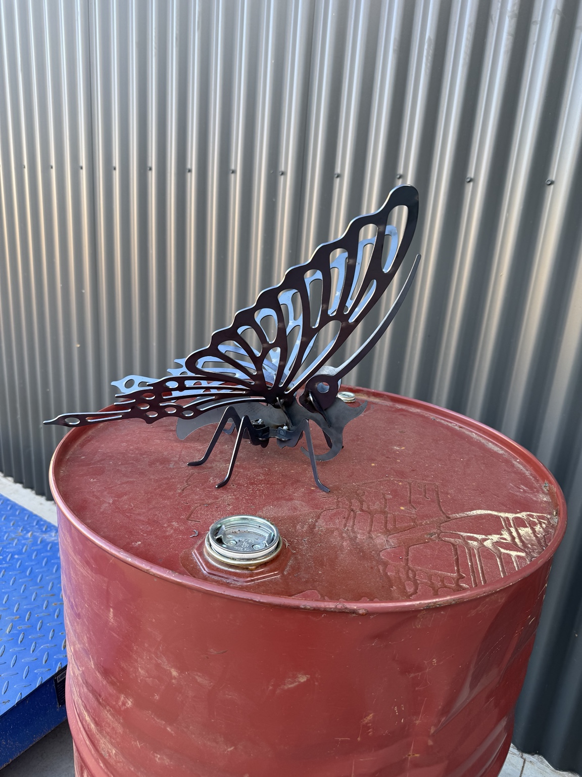 Black butterfly garden stake in a pot